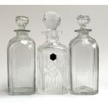 A pair of cut glass decanters, 24.5cmH; together with a Stuart Crystal decanter, 26.5cmH