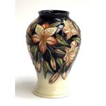 A Moorcroft vase, with Peruvian lily design, initialled MRJ to base and dated 2003, 16cmH