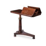 A Victorian mahogany reading table circa 1860 with two ratchetted reading stands to one end, on