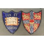 Two plaster shield wall plaques, 'Lux et Veritas', 55cmH