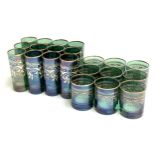 A set of 12 green Bohemian glass drinking glasses together with 9 tumblers