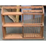 A pine plate rack, inset with a 1962 one pence coin, 101x24x76cm