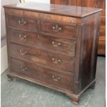 An early 19th century mahogany chest of two short over three long drawers, flanked by reeded