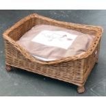 A wicker dog basket, with cushion, 66x45x30cm