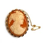 A 9ct gold shell cameo brooch with ropetwist border and safety chain, 4cmL, approx. 10.9g