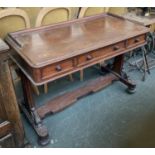 A Victorian mahogany writing desk, with three frieze drawers, on twin supports with acanthus detail,