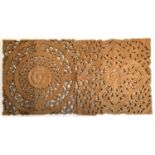 Two decorative hardwood carved panels, each 46cm square