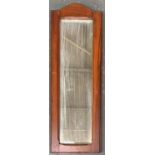 A narrow wall mirror with bevelled glass, 66x23cm