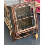 A 19th century tiger bamboo glazed wall cabinet, with floral impressed paper decoration, 46x24x70cm