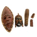 A collection of carved wooden items to include Indonesian mask, 52cmL, Tiki mask etc
