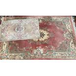 A large Chinese wool floral rug, pink ground, 175x295cm; together with one other smaller, 90x150