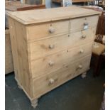 An early 20th century pine chest of two short over three long drawers, on turned feet, 108x53x108cm