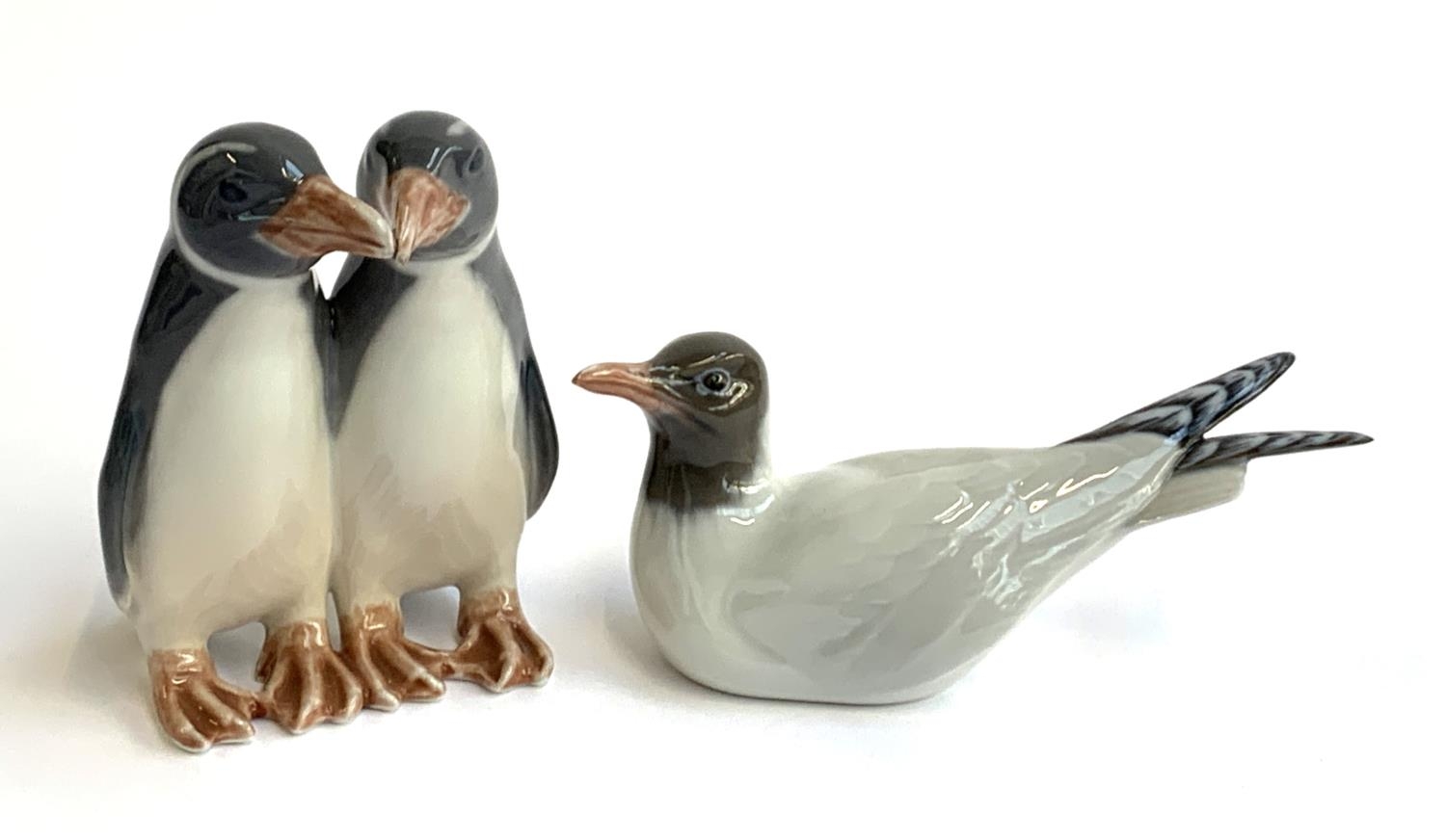 Two Royal Copenhagen figurines, pair of penguins no. 1190, seagull no. 1468