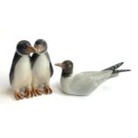 Two Royal Copenhagen figurines, pair of penguins no. 1190, seagull no. 1468