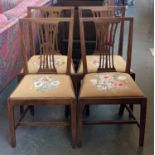 A set of four George III mahogany splatback dining chairs with drop in seats, possibly East Anglian