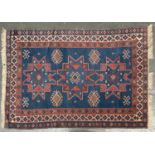 A blue ground Persian rug with triple border, 170x118cm