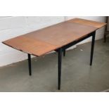 A mid century draw leaf table, ebonised base with bolt-on legs, 115x75x75cmH