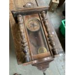 A cased wall clock, 69cmH