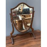 A 19th century shield shaped adjustable dressing mirror, 59cmH