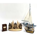 An early 20th century adjustable desk calendar; together with a village diorama, and two model ships