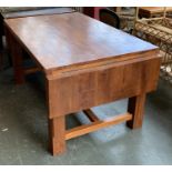 A substantial hardwood dining table, 140x90x75cmH, the drop ends each adding 30cm