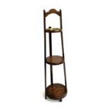 A three tier oak smoking stand with removeable brass ashtray, 76cmH