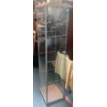 An Ikea Detolf display cabinet, with three glass shelves, 163x36x43cm