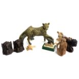 A resin figure of a leopard on tree limb; together with various other resin and carved wood animal