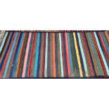 A striped kilim rug, 325x140cm