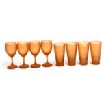 A lot of orange frosted glasses to include 4 drinking glasses and 4 wine glasses