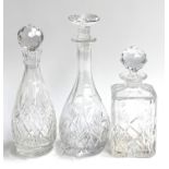 Three cut lead glass decanters, the tallest 32cmH