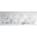A very large quantity of glassware to include wine glasses, champagne flutes, brandy balloons (4