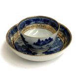 A clobbered Chinese export blue and white bowl and saucer, with Lempertz sticker to base complete