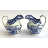 A pair of blue and white transfer ware jugs, 16.5cmH