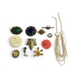 A small lot to include coral coloured celluloid brooch, Czech paste brooches; Czech pressed glass