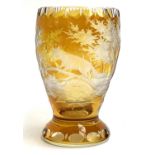 An amber Bohemian glass, etched with fox, initialed NS and numbered 16/500