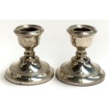 A small pair of loaded silver candlesticks, Cohen & Charles, Birmingham 1967, 6.5cmH