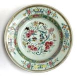 A 19th century famille rose dish, depicting men with fishing baskets, 23cmD