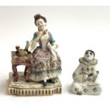 A Continental porcelain figure of a lady with fruit, 13.5cmH; together with a figure of a clown