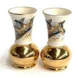 A pair of Braunton Devon vases, depicting ducks in flight, heightened in gilt, 11cmH