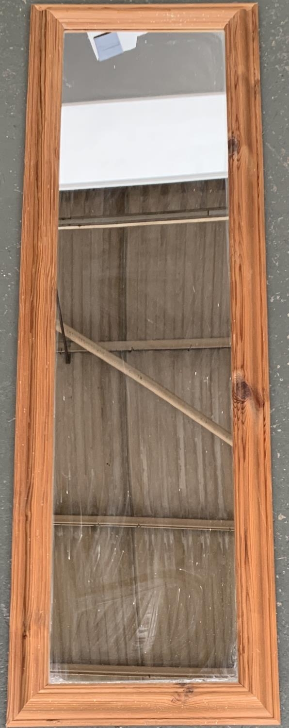 A pine framed long mirror, 134x42cm