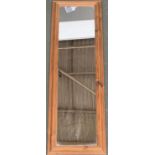 A pine framed long mirror, 134x42cm