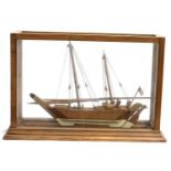 A glass cased model of a tall ship, case 66cmL