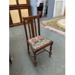 An oak chair upholstered in a William Morris style fabric