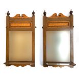 A pair of mahogany and burr maple wall mirrors with bevelled glass and shelf, each 56x29cm