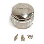 A silver topped glass dressing table pot, the lid hallmarked Birmingham 1914; together with three
