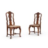 A pair of Dutch carved and figured walnut side chairs in 18th century style, each 110cmH