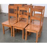 A set of six hardwood dining chairs