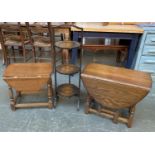 Two oak joint stool style drop leaf tables; together with a three tier folding cake stand