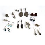 A lot of 12 pairs of silver earrings, to include marcasite, pearls, glass etc